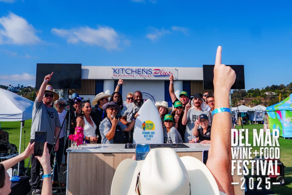 Kitchens Plus staff and presenters pose in front of the Grand Stage at the Del Mar Wine and Food Festival.
