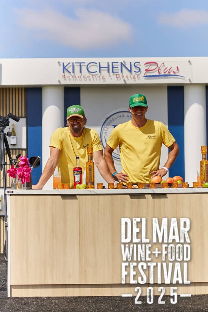 Chefs in yellow shirts present to the crowd at the Del Mar Wine and Food Festival.